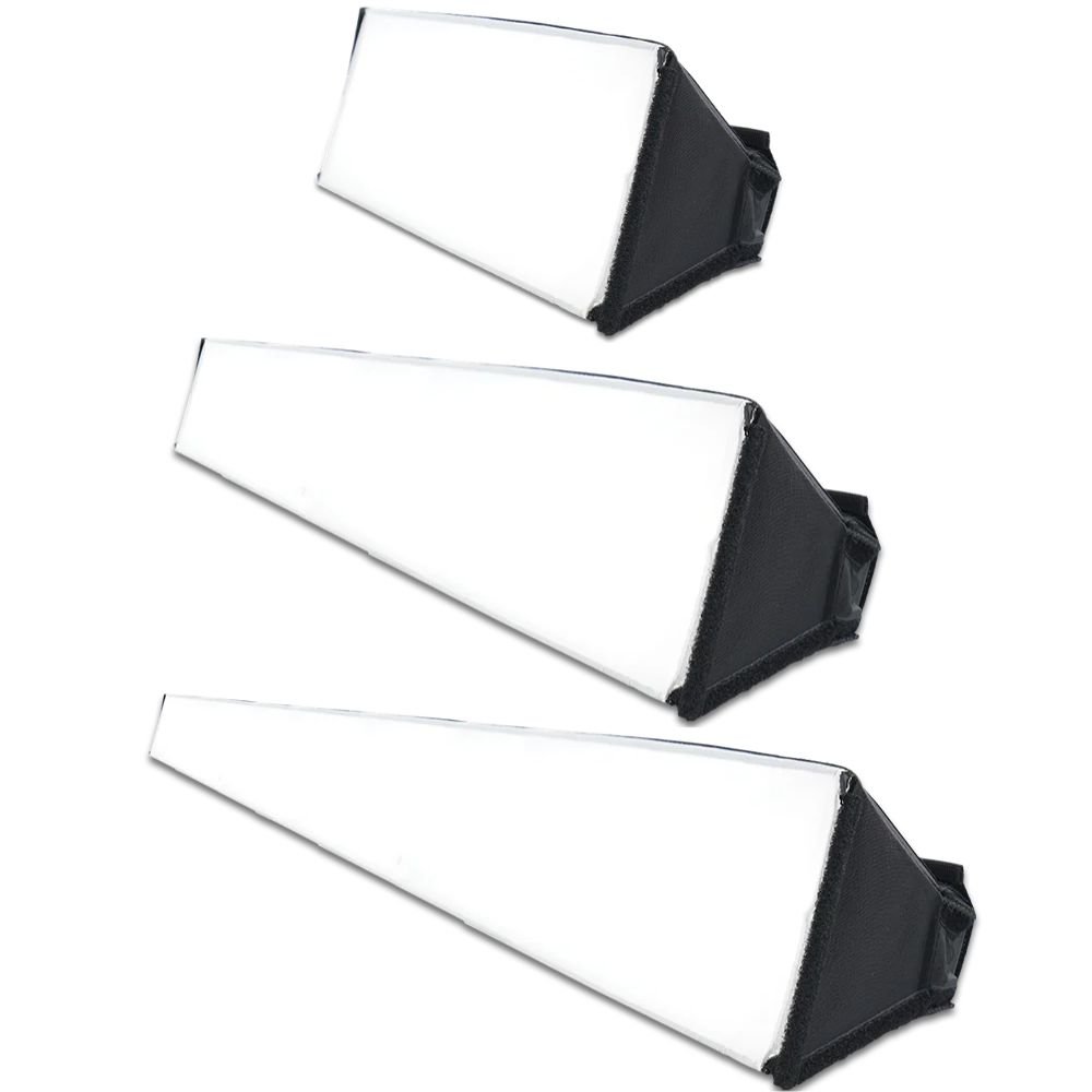Three White Rectangular Sanding Blocks with Black Angled Ends, Arranged Diagonally on a White Background.