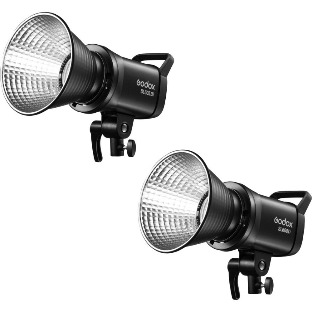 Sl60 | Spotx Two Black Godox Studio Flash Heads with Large Silver Reflectors Set Against a White Background.
